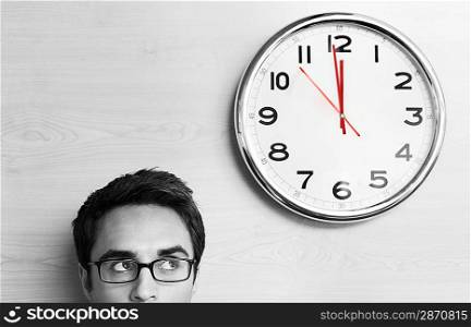 Anxious Businessman Looking at Office Clock