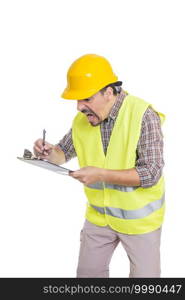 Anxious male builder in hardhat and reflective vest taking notes on clipboard in hurry while standing on white background. Panicking male engineer taking notes on clipboard