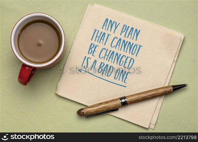 any plan that cannot be changed is bad one inspirational reminder and warning, handwriting on  a napkin with a cup of coffee, goal setting and business concept