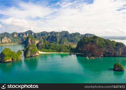 ao nang and rai lay with pranang beach and long tail speedboat passengers tourist in high season at kra bi Thailand aerial landscape view