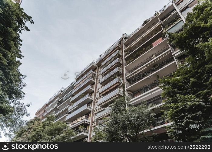 apartment building city with vegetation