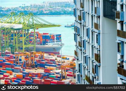 Apartment building, international commercial port of Singapore, ships, colorful cargo containers, freight cranes
