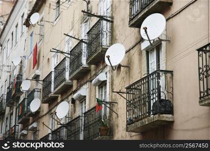 Apartment building with satellite dishes in Lisbon, Portugal.