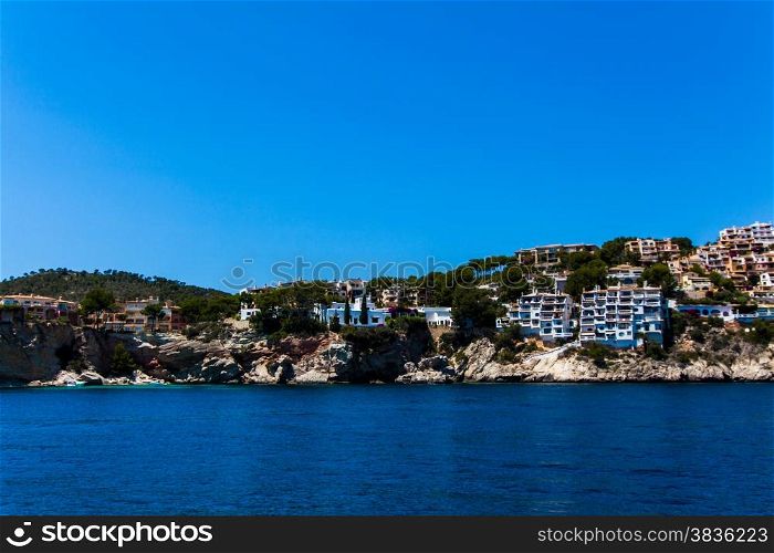 Apartment buildings by Mediterranean Sea. view of Mallorca coast, balearic islands, Spain