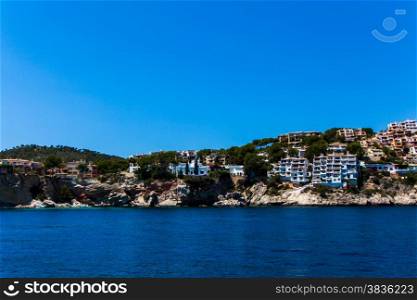 Apartment buildings by Mediterranean Sea. view of Mallorca coast, balearic islands, Spain