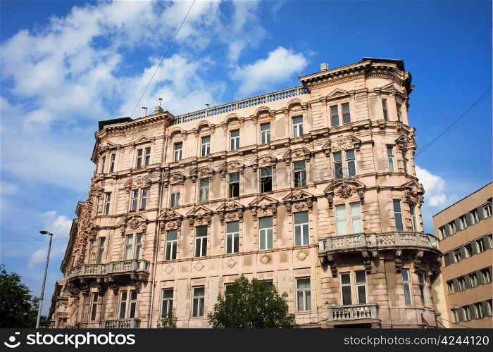 Apartment house with ornate facade, historic residential architecture in Budapest, Hungary.