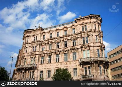 Apartment house with ornate facade, historic residential architecture in Budapest, Hungary.