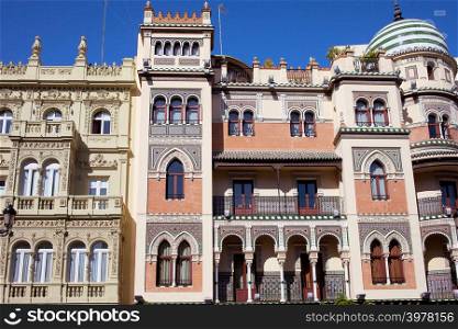 Apartment houses traditional facade in El Arenal historic quarter of Seville, Spain.