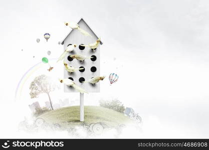 Apartments for friendly living. Conceptual image with nesting box and many birds living in it