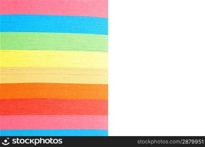 aper with bright strips lies on white surface