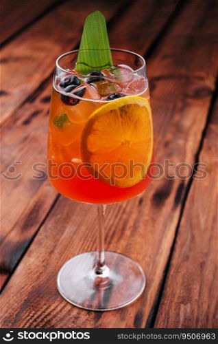 Aperol Spritz with ice on the table close up