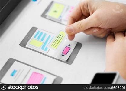 app design, technology and business concept - web designer working on user interface and creating wireframe layout at office. web designer working on user interface wireframe