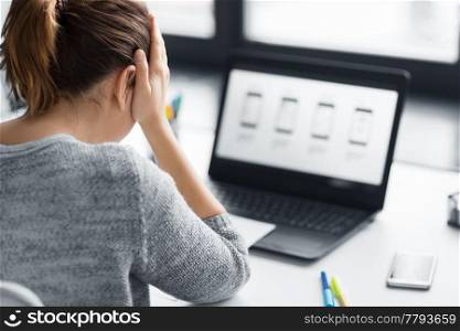 app design, technology and failure concept - stressed web designer with user interface layout on laptop computer screen at office. stressed designer with user interface on laptop