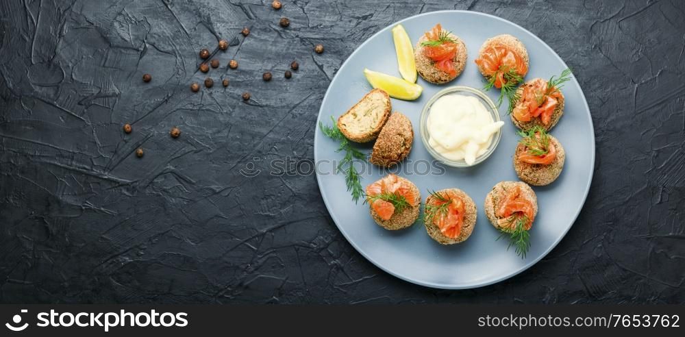 Appetizer homemade cod roe fish meatballs.Fish cutlets decorated with salmon.. Homemade fish meatballs
