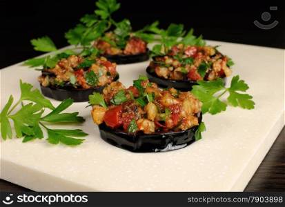 Appetizer of fried eggplant stuffed with vegetables, herbs