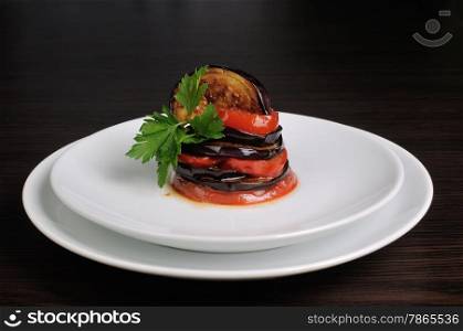 Appetizer of fried eggplant with tomatoes, parsley