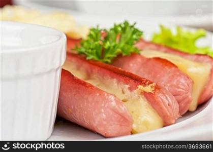 Appetizer - sausages with cheese and sauce