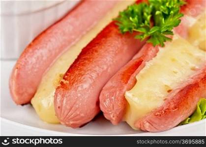 Appetizer - sausages with cheese and sauce