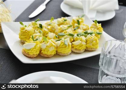 appetizer with cream, nuts and eggs on dish