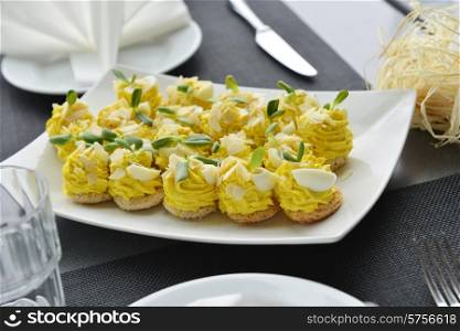 appetizer with cream, nuts and eggs on dish