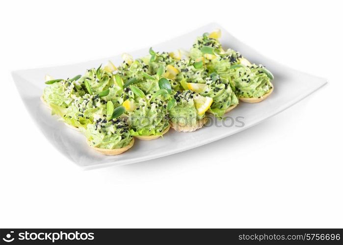 appetizer with cream, seed and lemon on dish