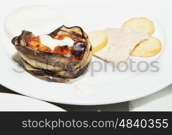 Appetizer with eggplant over white plate, horizontal image