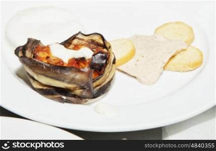 Appetizer with eggplant over white plate, horizontal image