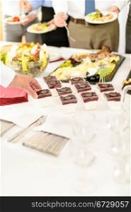 Appetizers mini desserts on catering buffet white tablecloth business event