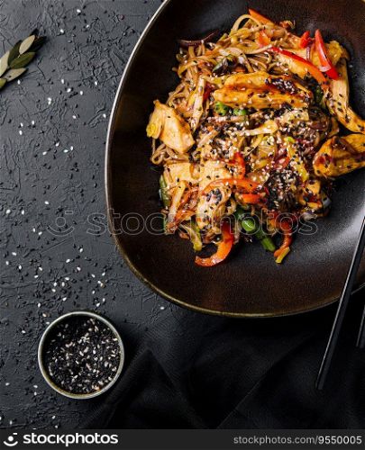 Appetizing asian cuisine chicken and vegetables udon noodles wok