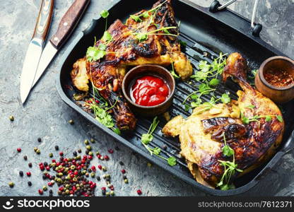 Appetizing chicken cooked in a grill pan.Popular meat food. Grilled chicken in a pan.