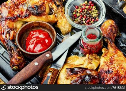 Appetizing chicken cooked in a grill pan.Popular meat food. Grilled chicken leg on grill