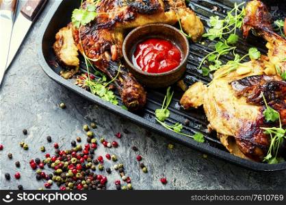 Appetizing chicken cooked in a grill pan.Popular meat food. Marinated grilled chicken meat