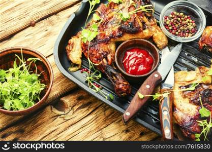 Appetizing chicken cooked in a grill pan.Roasted chicken fillet. Marinated grilled chicken meat
