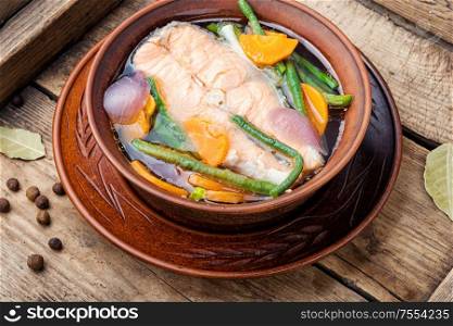 Appetizing dietary boiled salmon or trout.Boiled salmon fillet. Tasty salmon broth.