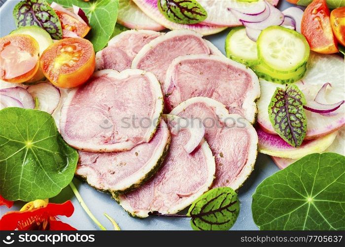 Appetizing dietary salad with veal tongue and radish. Meat tongue salad