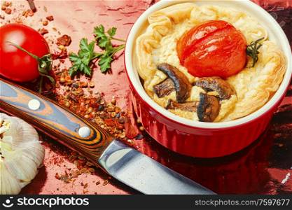 Appetizing garlic tart with tomato,mushrooms and cheese.Cherry tomato tart. Tart with tomato and mushrooms