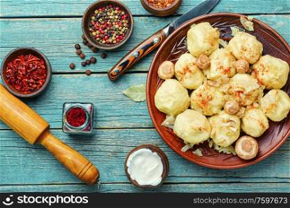 Appetizing homemade dumplings with mushroom filling.Lazy dumplings.Traditional dish of Ukrainian cuisine. Homemade varenyky with mushrooms.