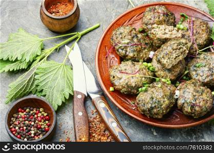 Appetizing homemade nettle meatballs cooked in the oven. Nettle cutlets in the oven