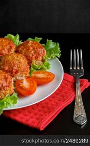 Appetizing meat balls in tomato sauce on a dark background. High protein healthy dish.. Appetizing meat balls in tomato sauce on a dark background. High protein dish.