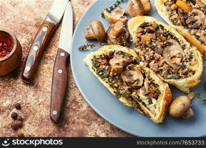 Appetizing mushroom pie or wellington mushroom. English cuisine. Sliced pie with mushrooms
