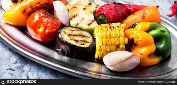 appetizing plate vegetables. grilled vegetables on a fashionable metal plate