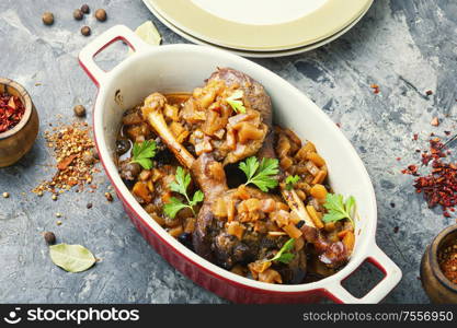 Appetizing roasted duck leg.Holiday duck legs baked in apple. Duck legs in a baking dish