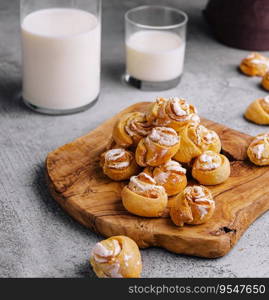 Appetizing ruddy buns-roses and milk bottle