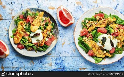 Appetizing salad of chicken breast, grapefruit, herbs and yogurt.. Salad with chicken and grapefruit