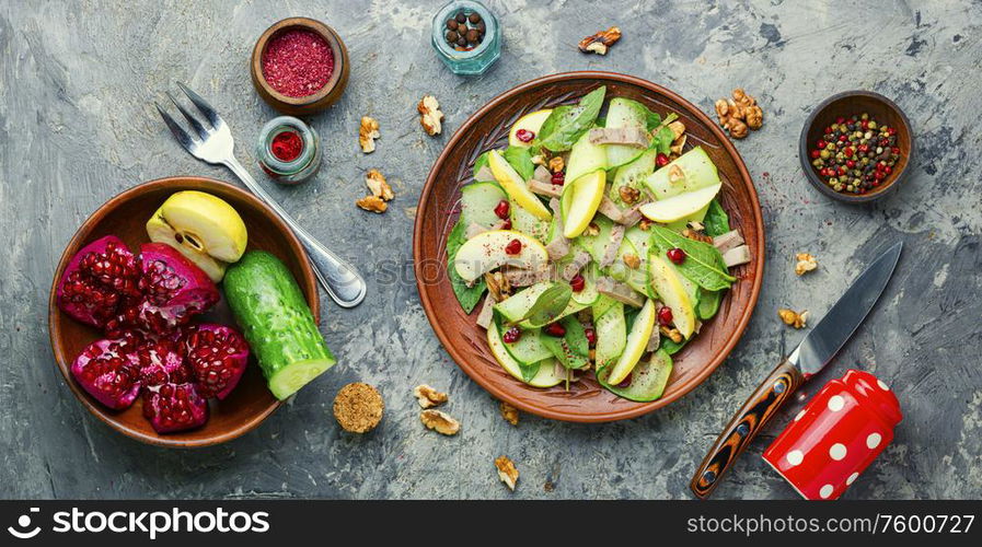 Appetizing salad of vegetables, fruits and meat tongue.Diet food.. Dietary spring salad with tongue.