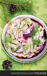 Appetizing salad with herring and vegetables.Russian cuisine.Traditional Ukraine salad herring under fur coat. Christmas salad with herring