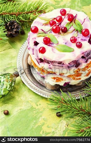 Appetizing salad with herring and vegetables.Seafood salad.Traditional Ukrainian salad.. Christmas salad with herring
