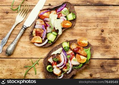 Appetizing sandwiches or bruschetta made from vegetables and meat. Homemade taco or bruschetta