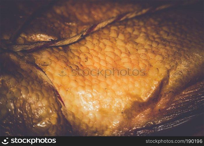 Appetizing smoked fish, ocean perch on a table.