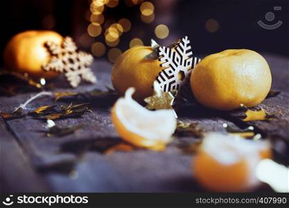appetizing tangerines close-up on the table. Christmas card